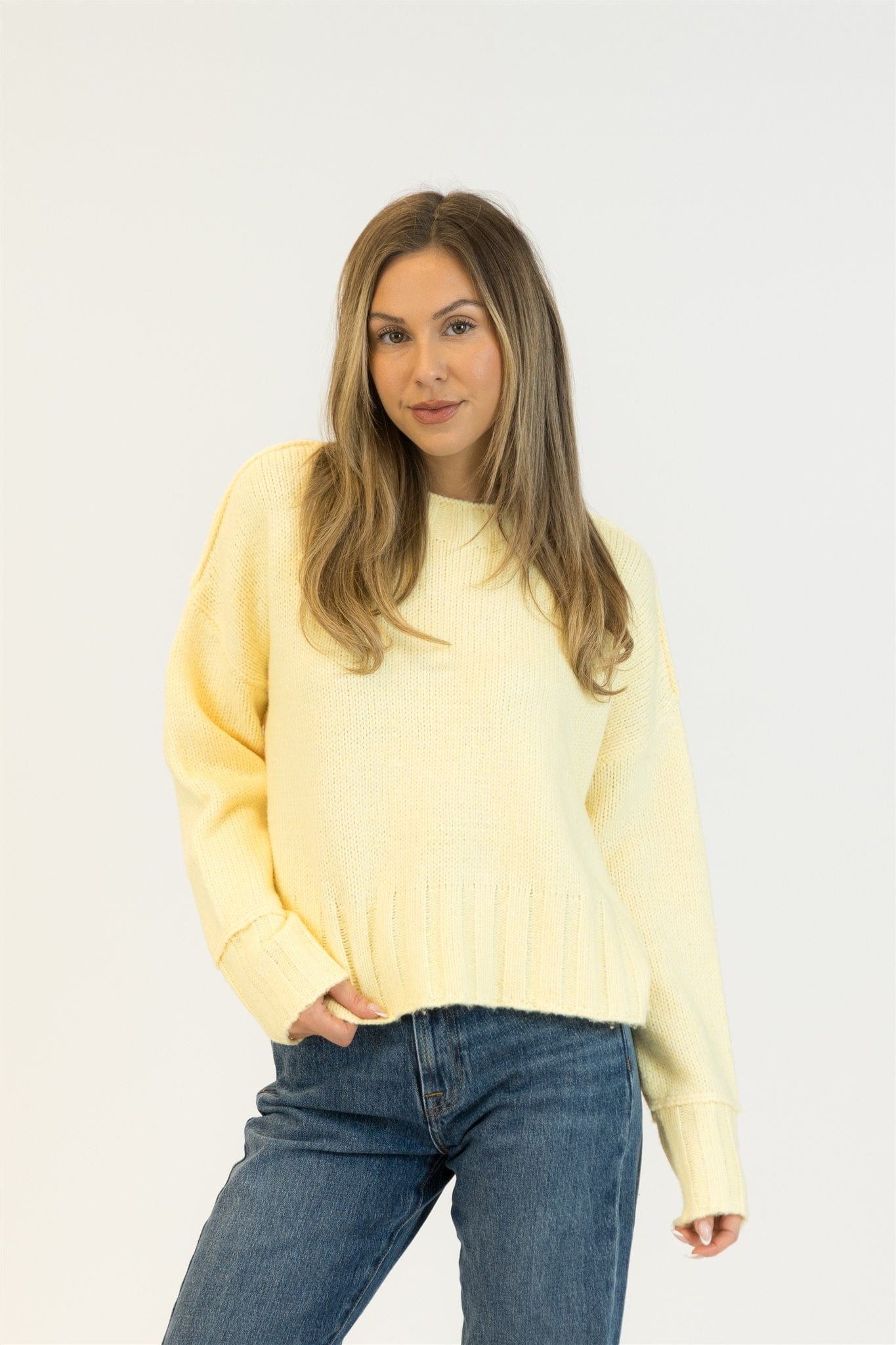 Model wearing Lyla + Luxe TIMMY sweater in Lemon Drop, full front view, photographed at Lemonberry in Aurora.