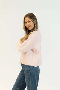 Side profile showing slouchy fit of the Pink Tulle version with jeans.