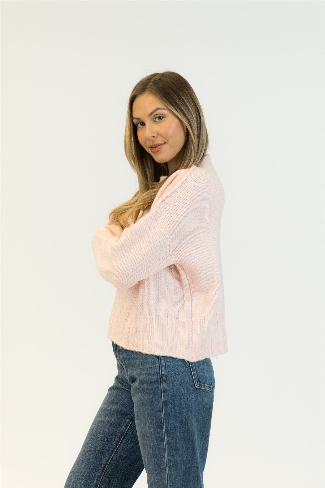 Side profile showing slouchy fit of the Pink Tulle version with jeans.