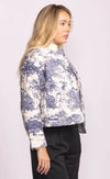 Side profile of model in the Toulon Jacket by Pink Martini, showing structured sleeves and cropped hem