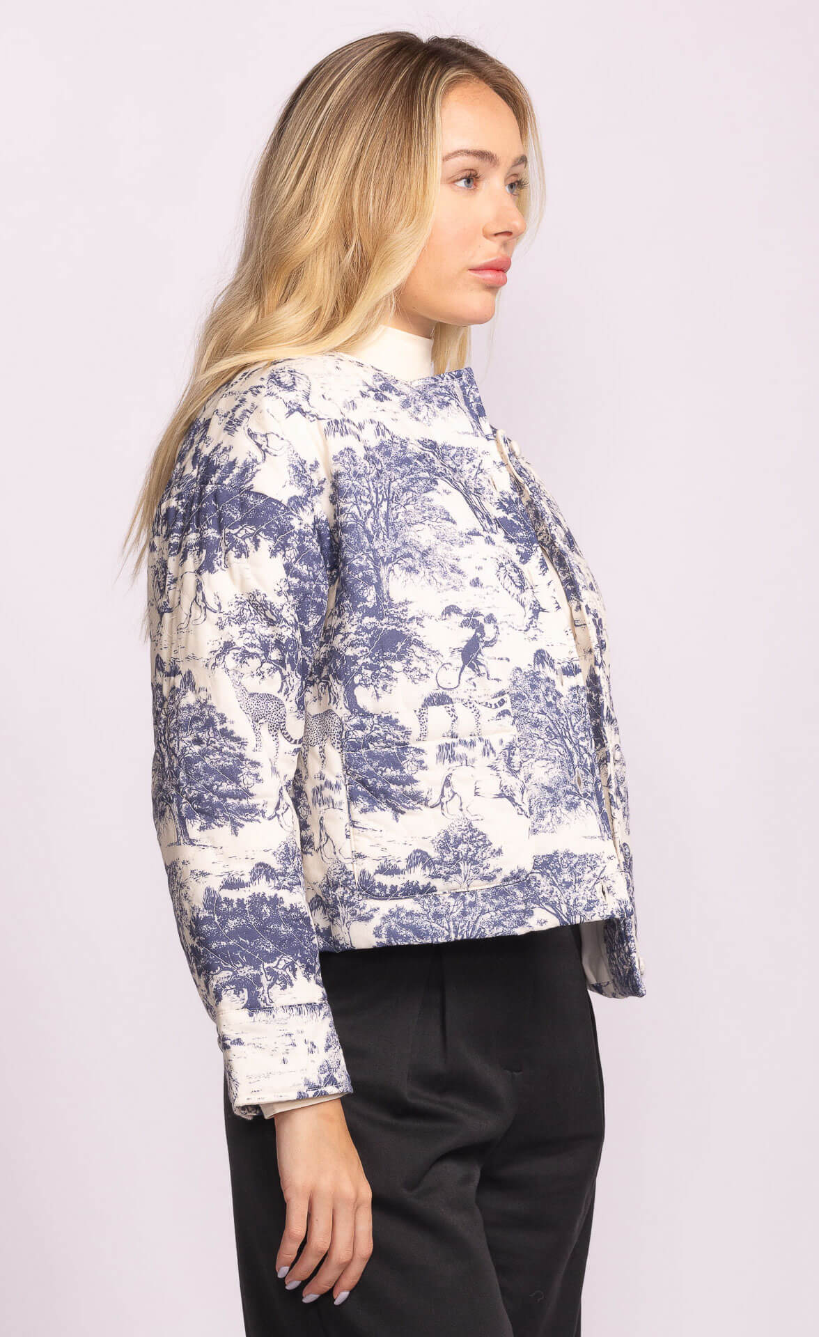 Side profile of model in the Toulon Jacket by Pink Martini, showing structured sleeves and cropped hem