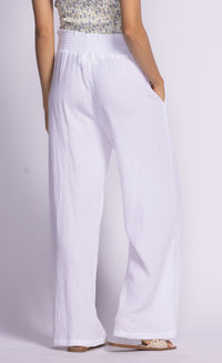 Back view of white Vail Pants by Pink Martini, showing the comfortable elastic waistband.