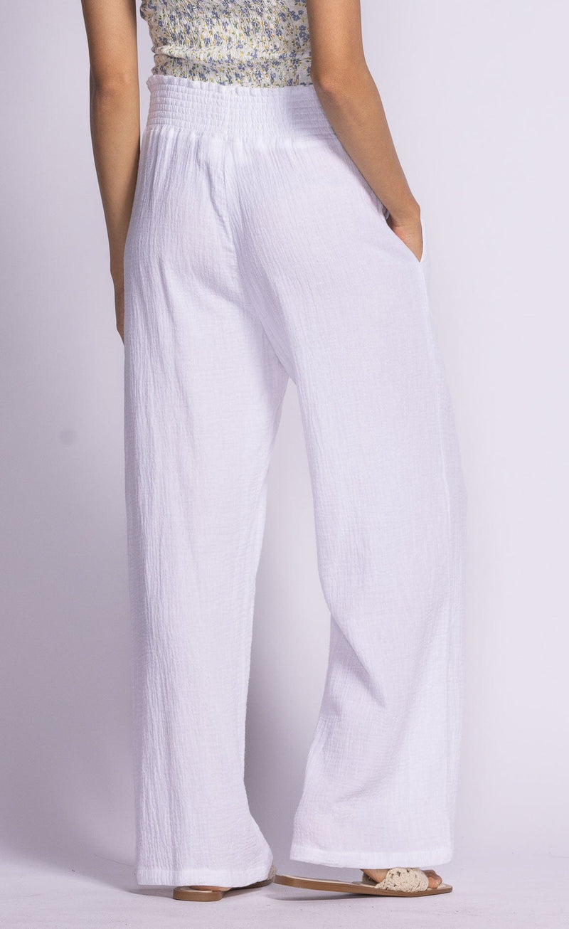 Back view of white Vail Pants by Pink Martini, showing the comfortable elastic waistband.
