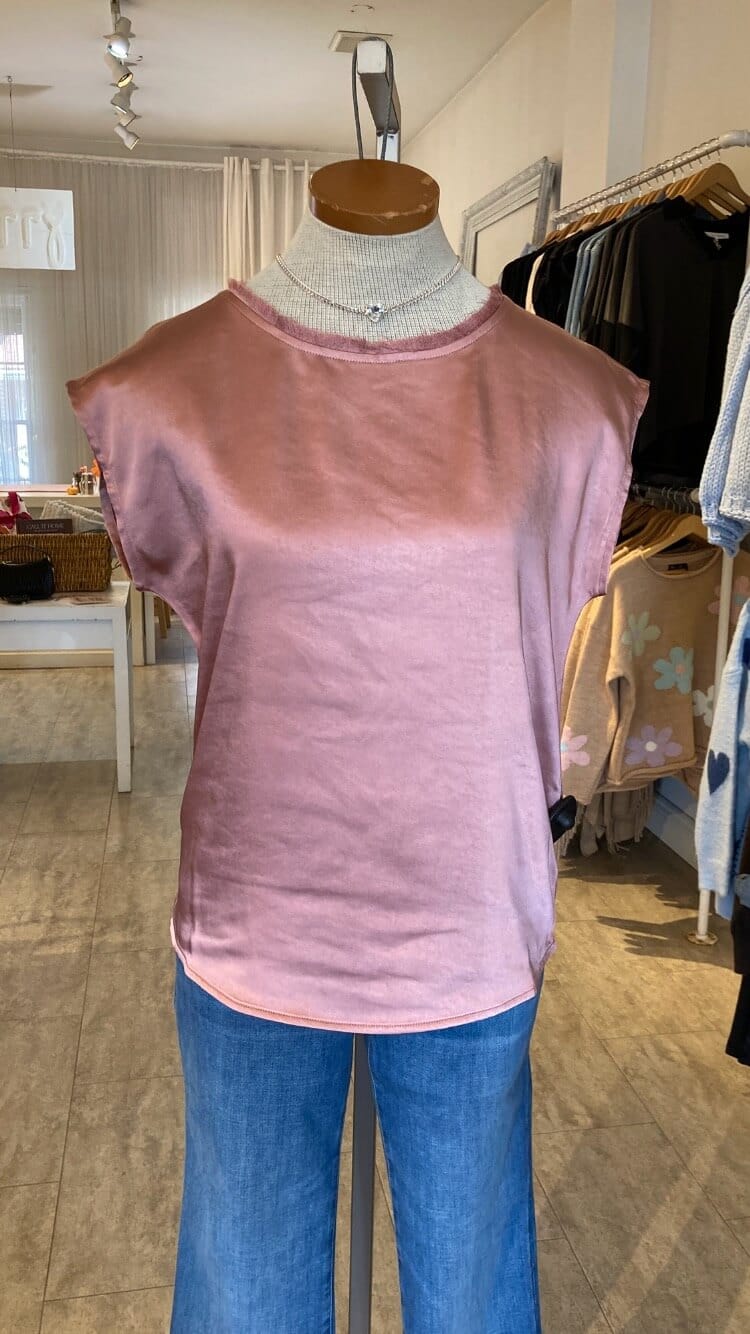 Pink sleeveless Willow top by Melissa Nepton on a mannequin with blue jeans in Lemonberry in Aurora Ontario