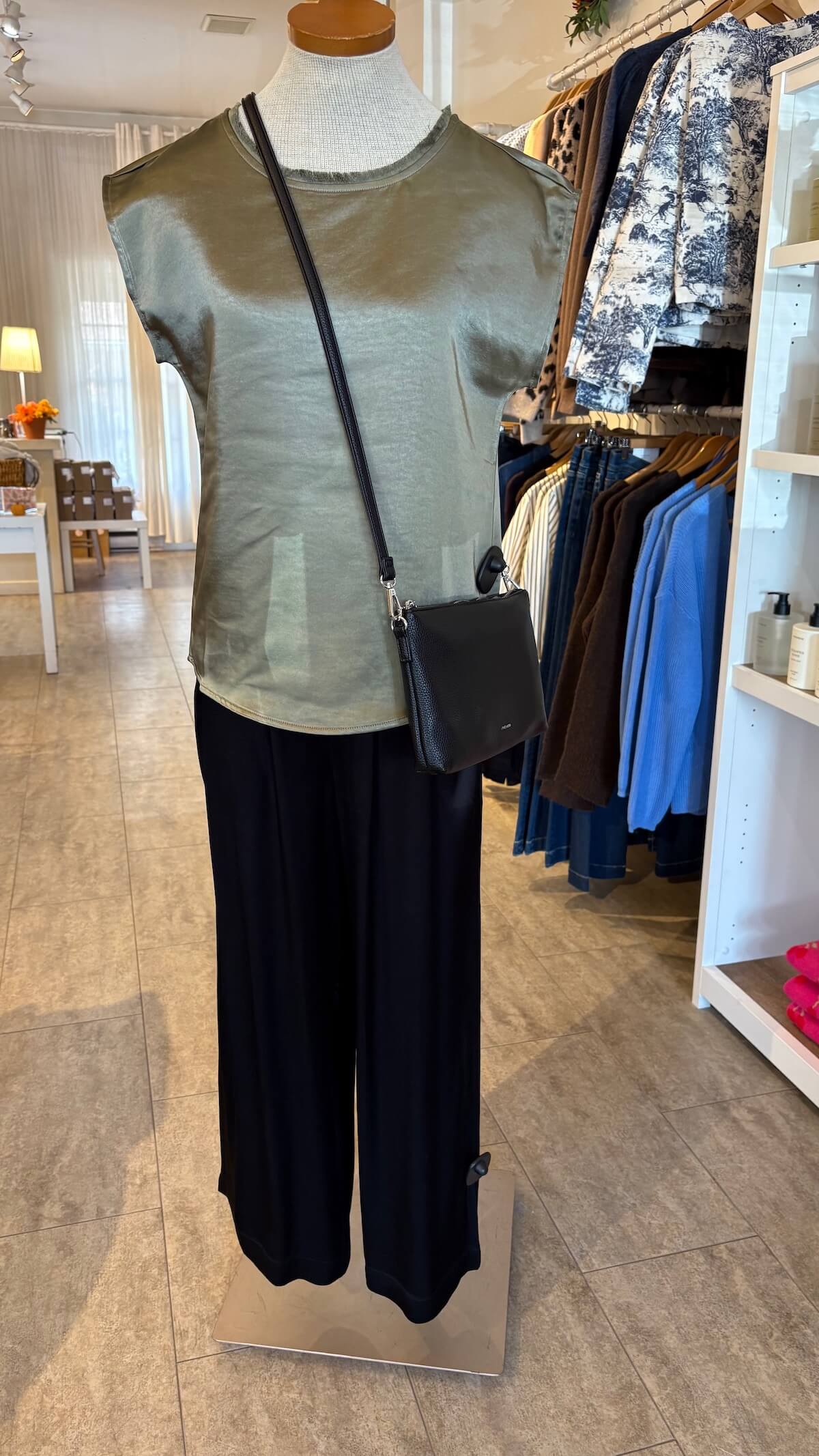 Mannequin wearing Melissa Nepton Willow Tee and black pants with a crossbody bag in Lemonberry