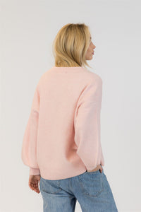Back view of pink Lyla + Luxe Yassie sweater showing soft texture and relaxed fit