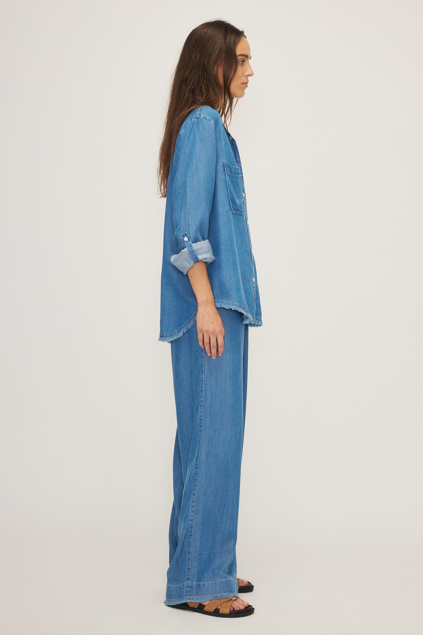 Side view of a model wearing the Yoko blouse by Melissa Nepton, available at Lemonberry in Aurora, ON.