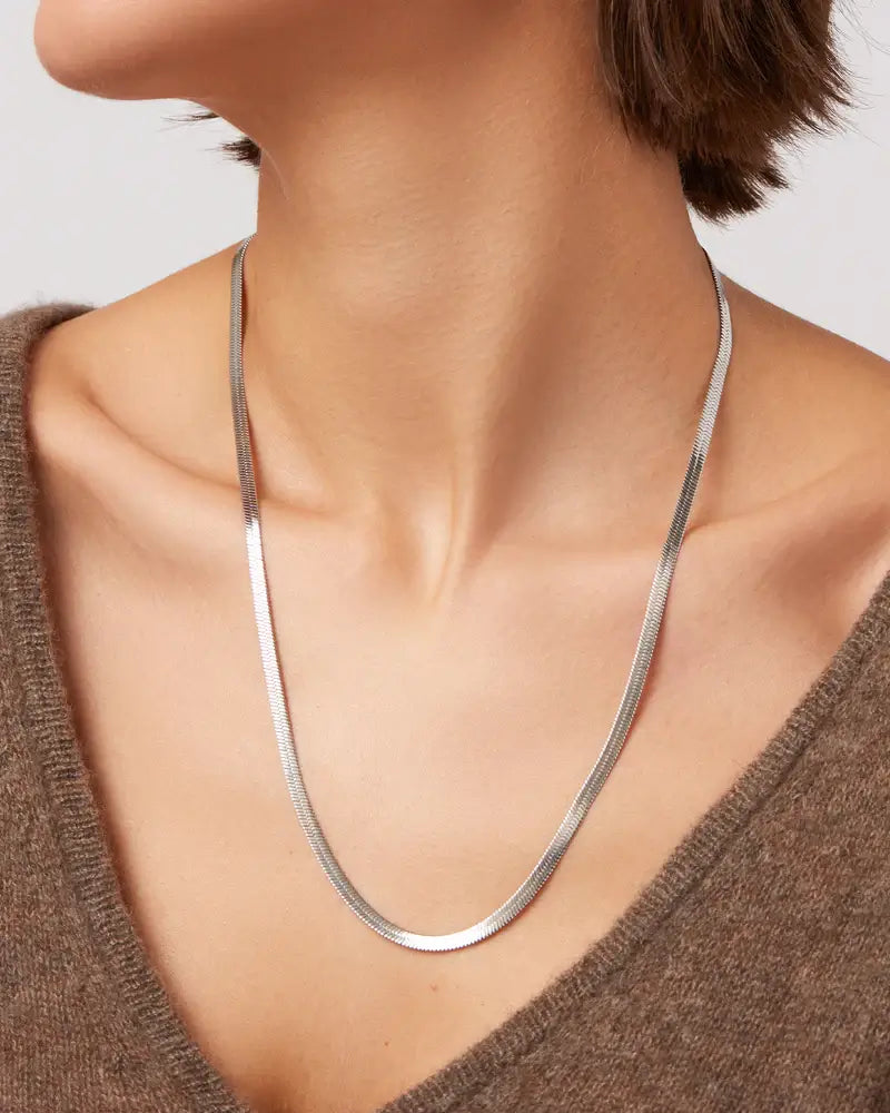 Zeina Chain by Jenny Bird styled over a soft brown neckline — perfect warm tones for fall layering in Richmond Hill