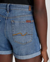 Close up of the signature swirl on the pocket of the mid roll shorts by 7FAM
