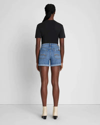 A back view of the Mid Roll Shorts by 7 For All Mankind, in med blue wsh.