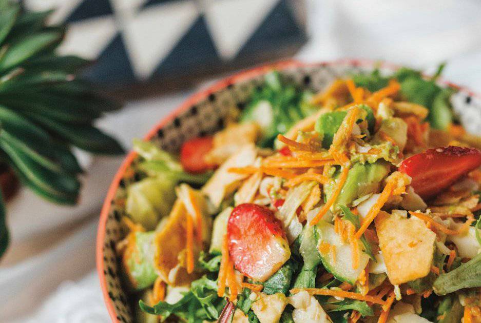 Close-up of a refreshing, beautifully layered salad with a variety of textures, as seen in Mandy’s Gourmet Cookbook.