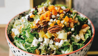 Close-up of a delicious and healthy salad, bursting with colors and nutrients, from Mandy’s Gourmet Cookbook.