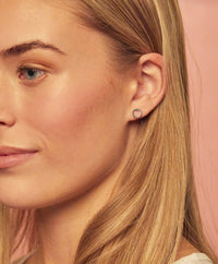 A model wearing one of the studs from Foxy Originals Geo Stud collection, available at Lemonberry, also known as Lemon Berry.